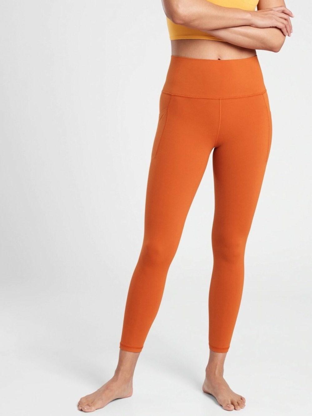 Athleta Salutation Stash Pocket II 7/8 Tight, Canyon Ora Orange Size Large